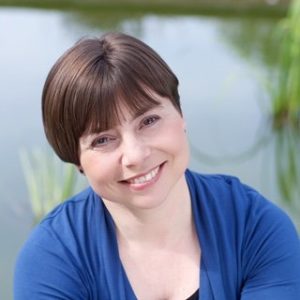 A headshot of Dr Dominique Thompson